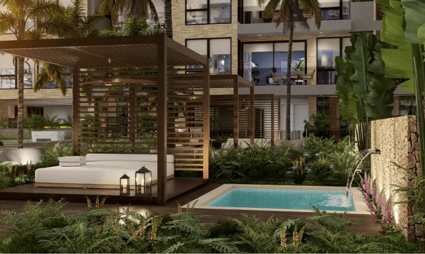 Zona de spa de Element con cama balinesa y jacuzzi rodeados de vegetación