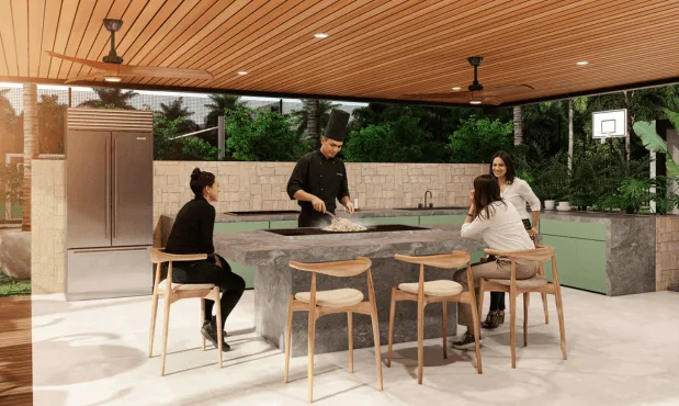 Social kitchen de Element con barra de teppanyaki bajo pérgola de madera