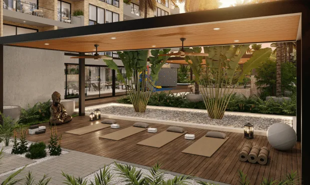Deck de yoga de Element en madera, con bambúes y jardín de piedra